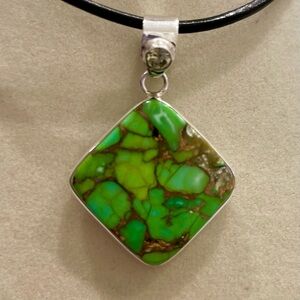 Turquoise and silver pendant. 1” long. NEW